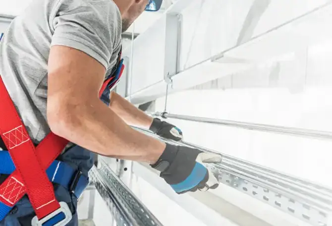 Technician installing a garage door
